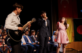 Vis Student playing Guitar and singing at Graduation 2022