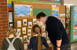 Teachers explaining climate for action week posters