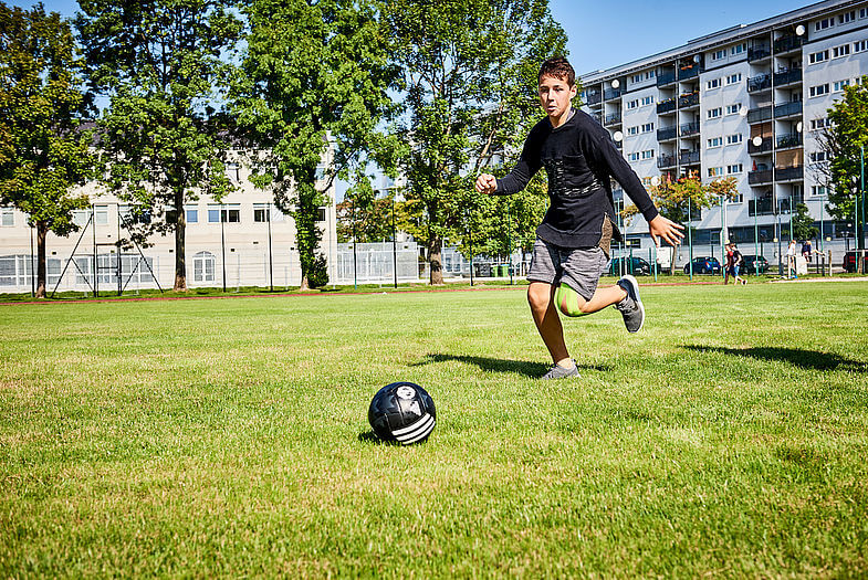 Vienna international school student playing football